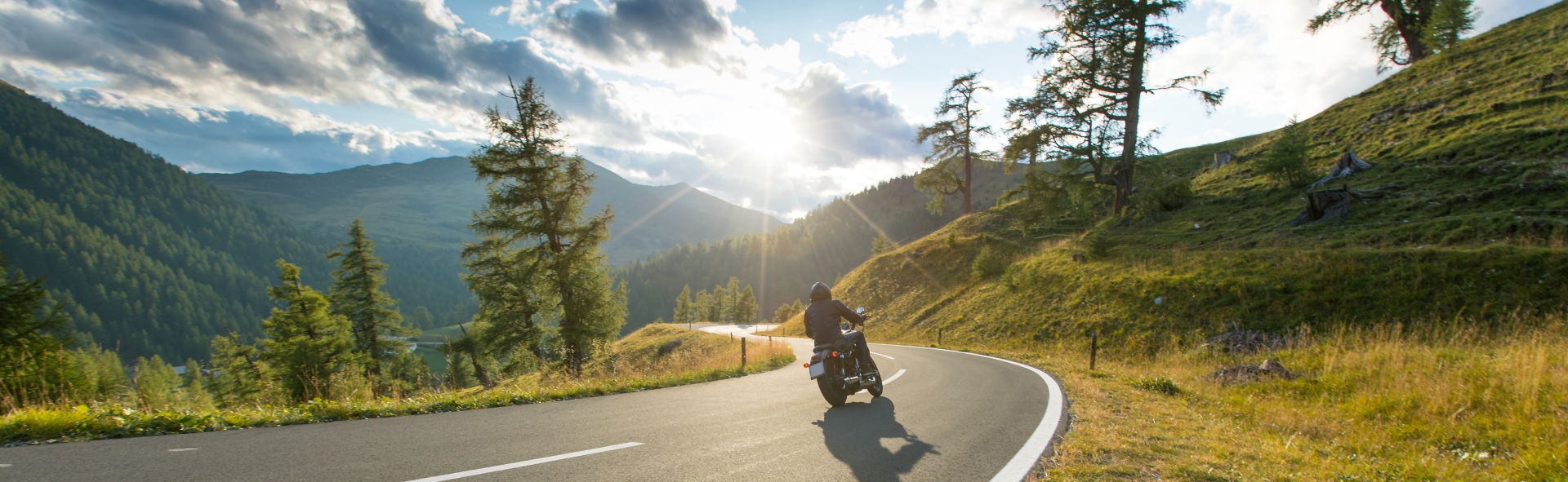 Motorcycle+driver+riding+in+Alpine+highway%2C+Nockalmstrasse%2C+Austria%2C+Europe.jpeg